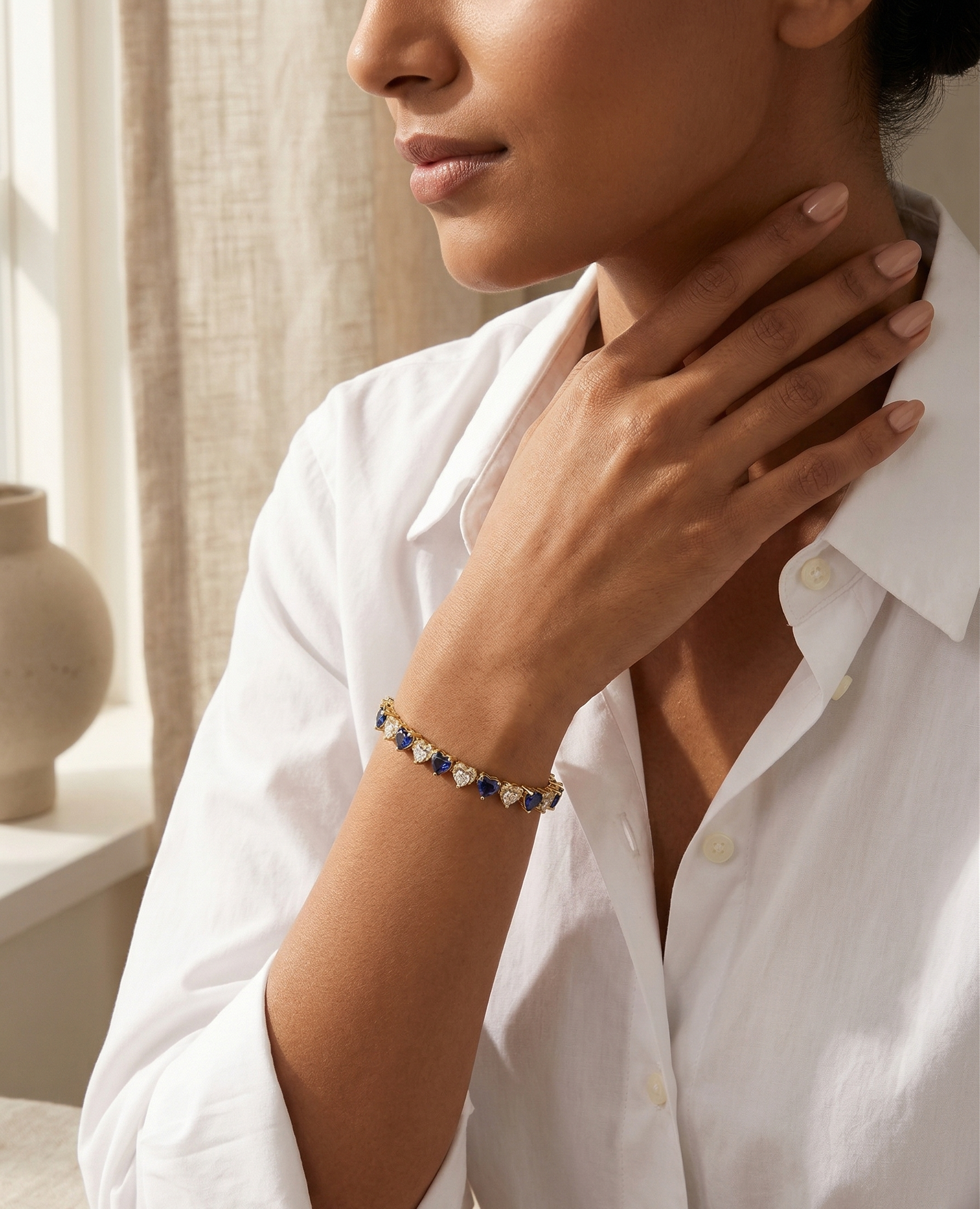 Woman wearing a bracelet with a neutral background