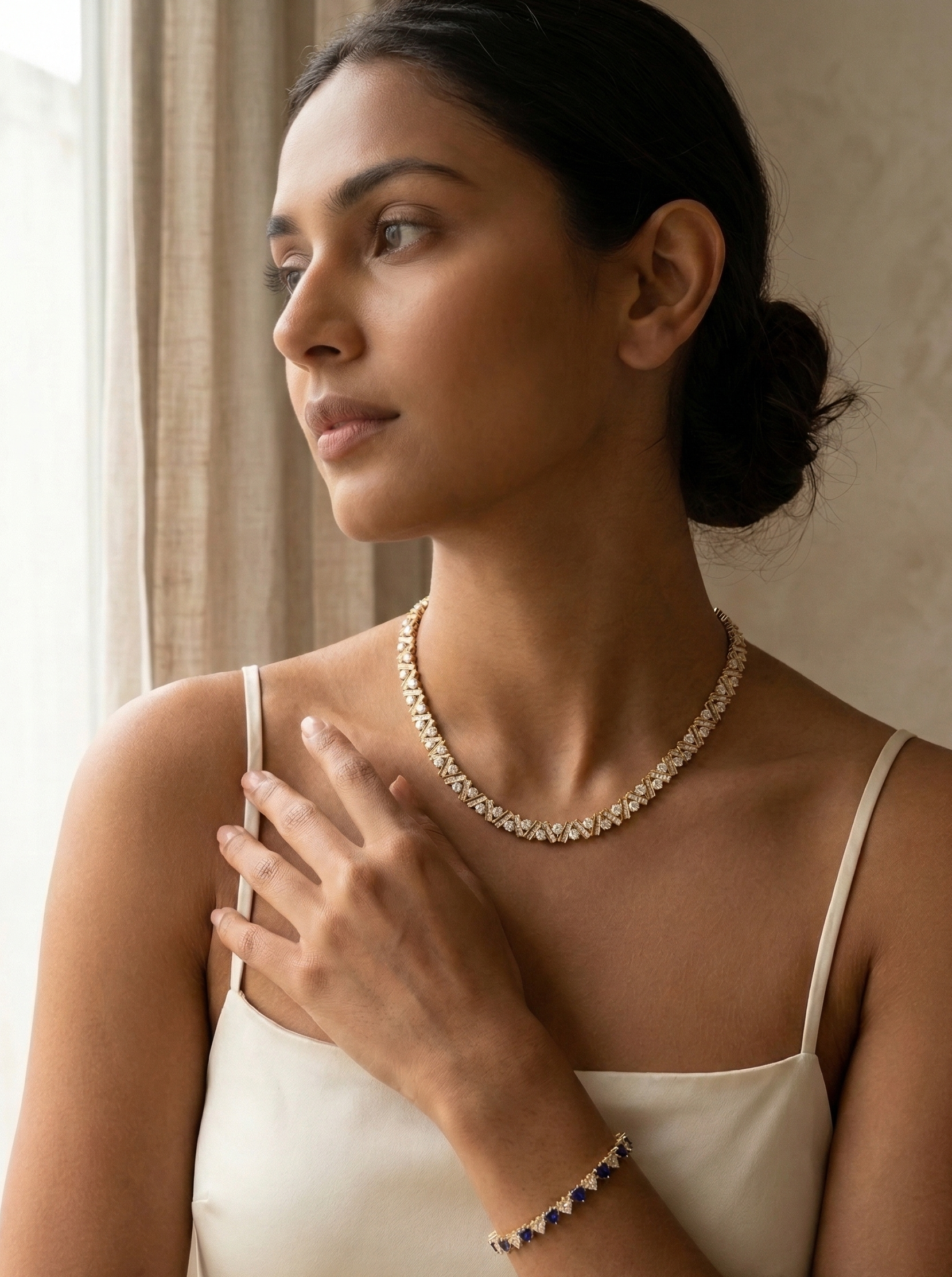 Woman wearing a necklace with a neutral background
